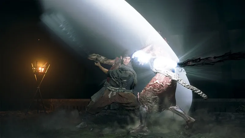 Official Onimusha: Way of the Sword screenshot of Musashi driving a bright sword slash into a demon in a night courtyard